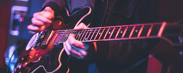 man-playing-guitar-close-up